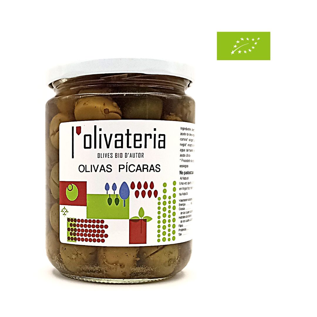 En la imatge s'observa un pot de vidre ple d'olives amb una enganxina blanca i en lletres negres es llegeix olives pícares